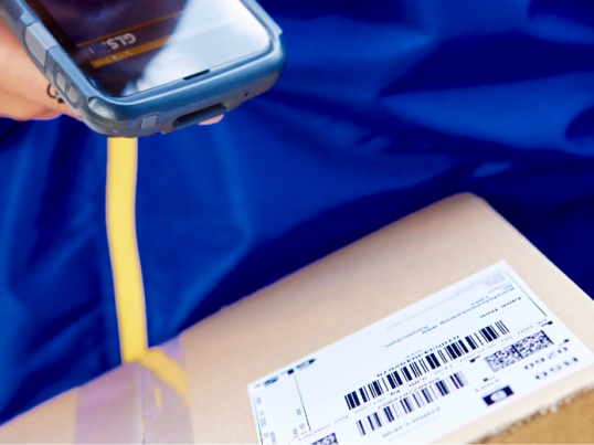 Delivery driver scanning a GLS box